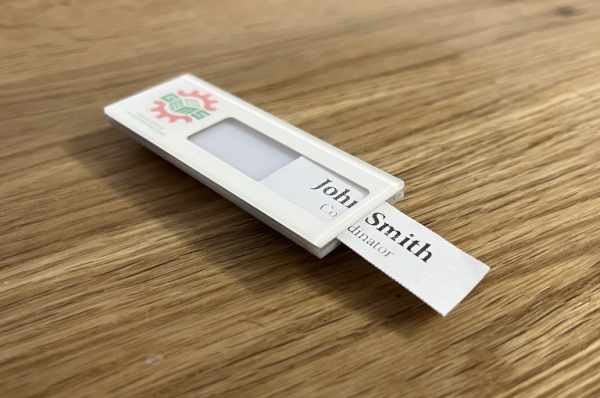 Wher to insert the name tag for an insertable flat acrylic name badge